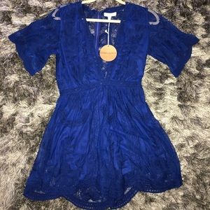 NWT Royal blue lace romper deep V neck size small